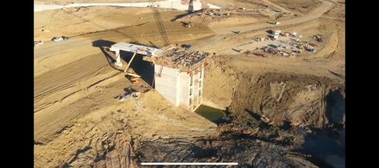 Aerial view of dam structure construction